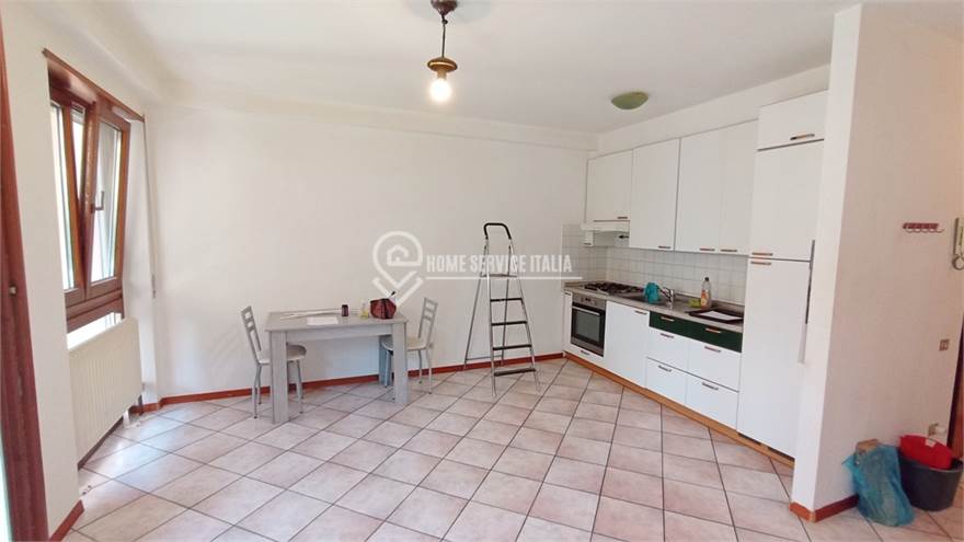 Zona giorno con cucina a vista